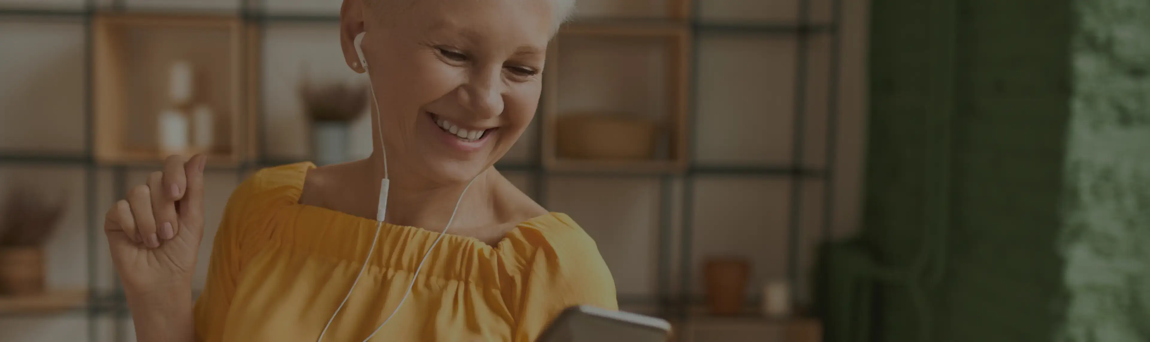 Elderly woman smiling with earphones